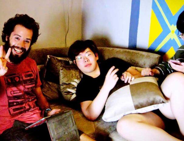 Advantages of Staying in Hostels Guests Chilling in Common Room